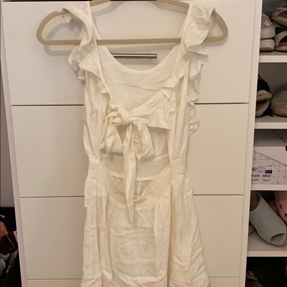 White, open back romper. Has light stripes - Picture 2 of 2